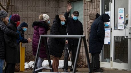Senior citizens, some accompanied by sons, daughters and caregivers, line up outside the Richmond Green Sports Centre, in Richmond Hill, Ont., on March 1, 2021 — the first day of mass vaccinations against COVID-19 for residents of York Region in the 80 + age cohort. York region vaccines 80+