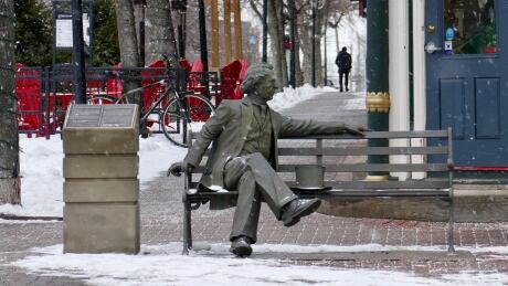 John A. Macdonald statue seated on a bench in downtown Charlottetown, PE on 29 Jan 2021. P.E.I.'s First Nations have concerns over how the city plans to deal with the statue and Macdonald's links to residential schools. John A. MacDonald statue