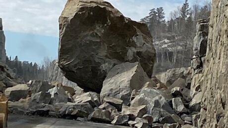 A large rock mass slid onto Highway 17A in the Kenora area on Thursday while crews were doing scheduled work to remove rock in the area. Highway 17A boulder