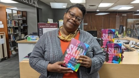 'There's a lot of stuff to talk about with this book,' says UPEI Librarian Yolanda Hood. Yolanda Hood, UPEI Librarian, holding Desmond Cole's book