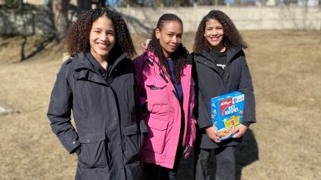 Solange Scott, middle, standing with her daughters Jordynn, left, and Jurnee. Racial profiling Walmart