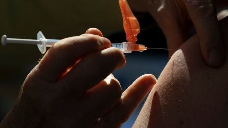 A dose of the Pfizer-BioNTech COVID-19 vaccine is given to a recipient at a vaccination site in Vancouver Thursday, March 11, 2021. COVID Cda 20210311 covid-19 vaccine vaccination coronavirus