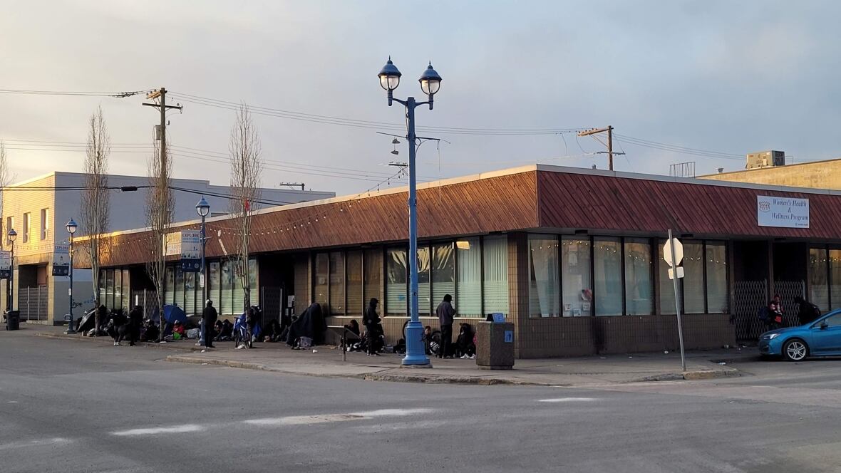 A building is seen across a road.