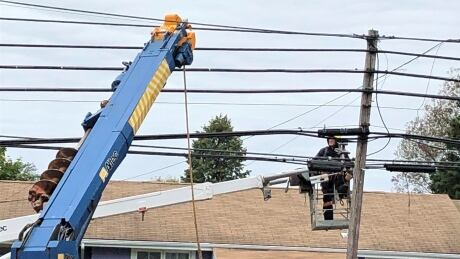 electricity, utility, Maritime Electric Power line technician at work in Charlottetown
