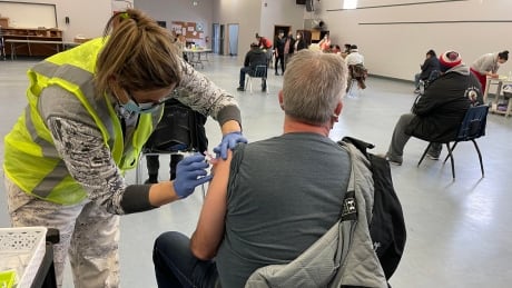 Sandy Bay Ojibway First Nation nurse Brandy Strong administers the Moderna COVID-19 vaccine. Sandy Bay vaccine clinic nurse