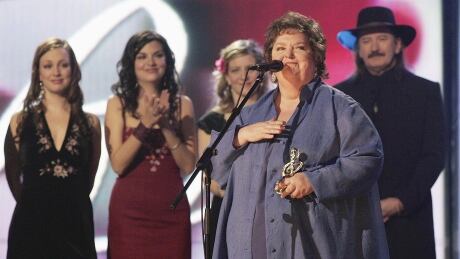Rita MacNeil, right, speaks after receiving a lifetime achievement award at the East Coast Music Awards Sunday Feb. 20, 2005 in Sydney N.S. On Friday, organizers announced MacNeil will be inducted into the Canadian Songwriters Hall of Fame on May 6. ECMA-SYDNEY TOPIX