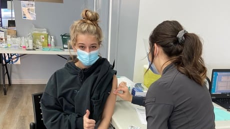 Sydni Grono, 16, got the COVID-19 vaccine in Drayton Valley, located 133 kilometres southwest of Edmonton. Grono qualified under 2b in Alberta's vaccine rollout. “I have cystic fibrosis which makes my lungs extra fragile everyday," she told CBC News. "Getting the vaccine gives me some peace of mind and some protection from dying or getting really sick from covid. I hope people get the vaccine so the world can go back to how it used to be. Alberta vaccine younger pictures