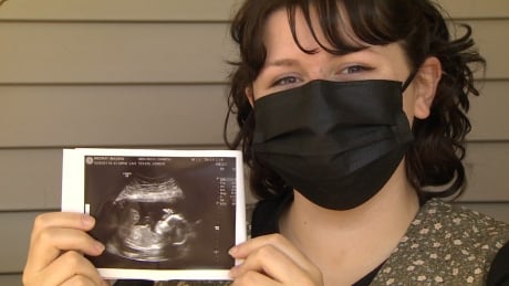 First-time mom Danica Miscisco says the province should prioritize pregnant women like her because they're at higher risk of complications from COVID-19. Danica Miscisco