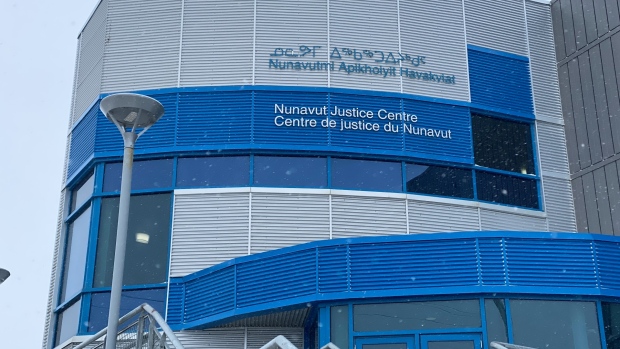 Iqaluit man found not guilty of attempted murder in 2019 snowmobile attack; Blue and silver exterior of large building in snow\. 