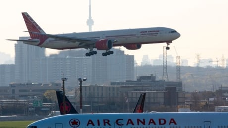 Air India flight 187 from New Delhi lands at Pearson airport in Toronto on Friday, April 23, 2021. The flight was the last landing allowed after all flights from India and Pakistan to Canada were suspended. THE CANADIAN PRESS/Frank Gunn COVID Cda 20210423