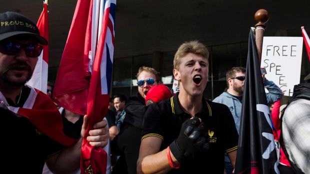 RCMP plans to go undercover online to trap violent extremists; Members of the Proud Boys shout at a group of counter-protestors at Nathan Philips Square in Toronto on Saturday, October 21, 2017\. 
