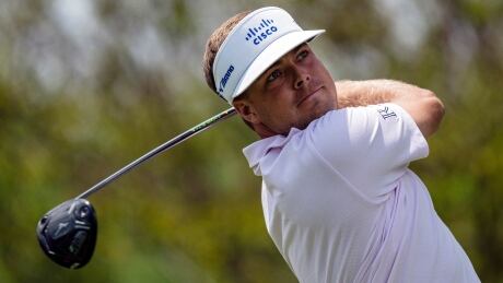 Keith Mitchell watches his tee shot on the second hole during the third round of the Wells Fargo Championship golf tournament at Quail Hollow on Saturday. Wells Fargo Golf