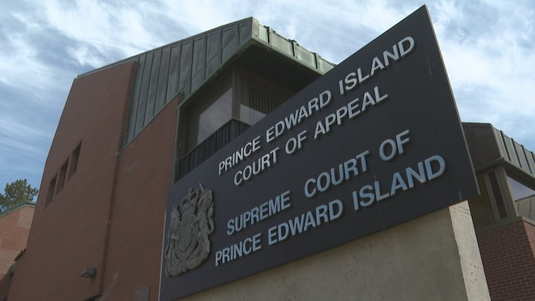 Exterior of a courthouse building with a sign reading Prince Edward Island Court of Appeal and Supreme Court of Prince Edward Island.