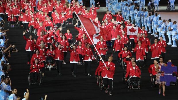 Canadian flag-bearer David Eng leads Canada into Maracana Stadium during the opening ceremony of the 2016 Paralympics in Rio de Janeiro. 600115688