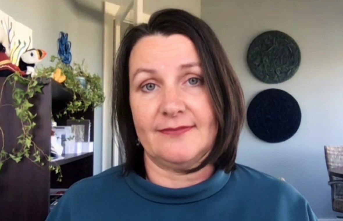 A woman with short brown hair.