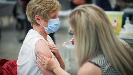 Gail Sparling, 74, receives a COVID-19 vaccine in Okotoks on May 26. vaccine covid