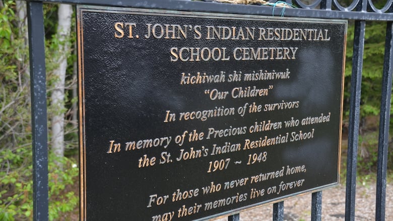 A sign that reads "St. John's Indian Residential School Cemetery'