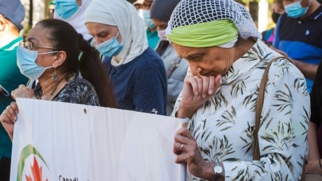 About 100 people gathered in downtown Montreal on Wednesday to pay tribute to the family killed in an attack on Sunday in London, Ont. QUE London Vigil 20210609