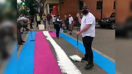 Logan Roberts was one of the people painting pride crosswalks on Wednesday night. Logan roberts