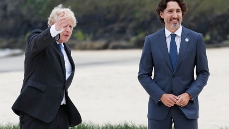 British Prime Minister Boris Johnson, left, speaks with Canadian Prime Minister Justin Trudeau during arrivals for the G7 meeting at the Carbis Bay Hotel in Carbis Bay, St. Ives, Cornwall, England, Friday, June 11, 2021. Leaders of the G7 begin their first of three days of meetings on Friday, in which they will discuss COVID-19, climate, foreign policy and the economy. Britain G7