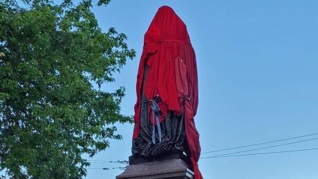 The statue of Sir John A. MacDonald in Kingston's City Park has been covered since Thursday. Sir John A MacDonald statue Kingston