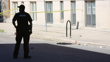 Police respond to a shooting on Young Street,on Monday June 14, 2021 Shooting on Young street,West End Winnipeg