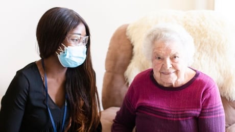 Clinical Coordinator Pamela Azenabor sits with Canterbury resident Ilse Kunik. Canterbury