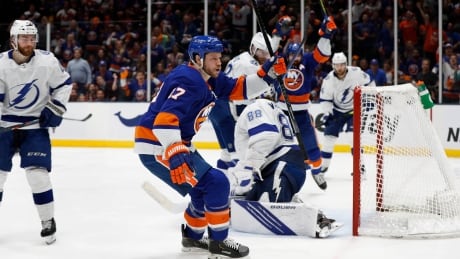 Islanders left winger Matt Martin (17) celebrates after scoring during the second period of New York's 3-2 win over the Tampa Bay Lightning in Game 4 on Saturday night. Lightning Islanders Hockey