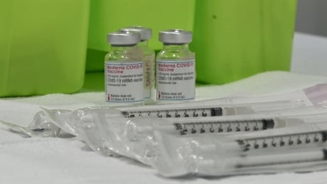 Paramount Fine Foods Centre Covid-19 vaccination clinic in Mississauga. Moderna vaccine.
See vials of Moderna Covid-19 mRNA vaccine with new sterile plastic syringes in front on 05 Mar 2021. Paramount centre vaccination clinic