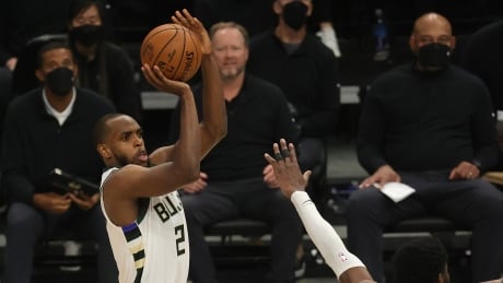 Milwaukee Bucks forward Khris Middleton, left, scored a team-high 40 points in the Bucks' 109-103 game four NBA Finals victory over the Phoenix Suns Wednesday. Khris-Middleton-140721