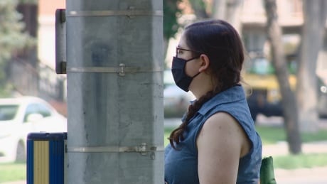 Regina and Saskatoon residents are still wearing masks even though the province lifted all public COVID-19 restrictions. Woman mask