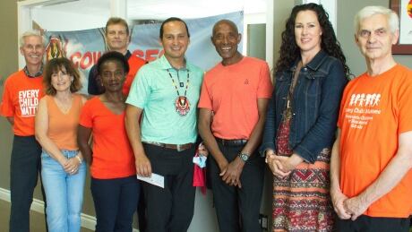 Ted Jaleta, third from right, and the Jaleta Pacers Running Club presented a donation of $10,000 to Cowessess First Nation Chief Cadmus Delorme, fourth from right, on Wednesday, July 21, 2021, to help in the search for unmarked graves at the site of the former Marieval Indian Residential School. Cheque Presentation