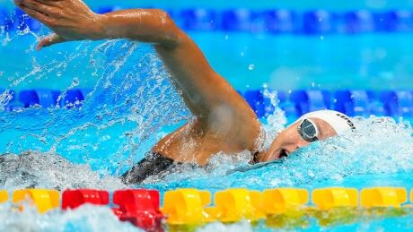 Canada's Penny Oleksiak, pictured, finished 10-100ths of a second shy of reigning Olympic champion Katie Ledecky's top time of 1:55.28 in qualifying for the 200-metre freestyle semifinals on Monday at Tokyo Aquatics Centre. oleksiak-penny-210726-1180