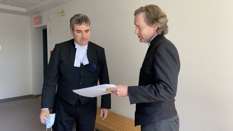 Crown prosecutors, Constantin Draghici-Vasilescu and Mark Donohue are shown during a break from the Nova Scotia Supreme Court trial that is taking place in Sydney. Crown lawyers Spaghetti Benders fraud case