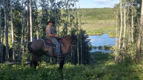 John Prosak on the trail from Sturgeon River Ranch into Prince Albert National Park. John Prosak