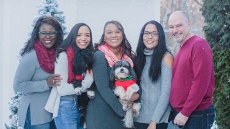 Diana Wooden, left, poses with her husband and their three daughters. Diana Wooden family