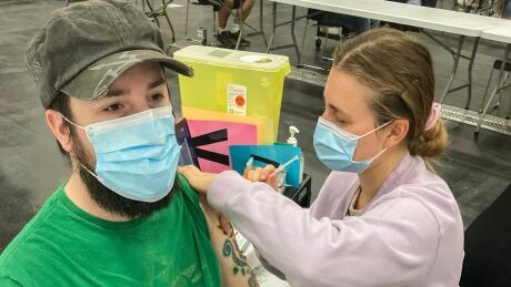 Tyler Marks, 33, received his second dose of the COVID-19 vaccine in Edmonton. The province says 55 per cent of Albertans are now fully vaccinated against COVID, and 64.4 per cent have now received at least one dose (or 75.7 per cent of those eligible). alberta covid
