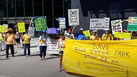 Residents rally outside Surrey City Hall to protest a new road in Bear Creek Park. Friends of Bear Creek