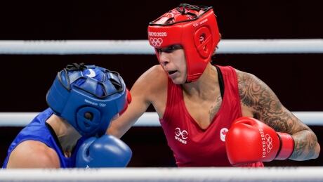 Canada's Tammara Thibeault, right, fights Netherlands' Nouchka Fontijn during their women's middleweight 75-kg boxing match at the 2020 Summer Olympics, Saturday, July 31, 2021, in Tokyo, Japan. Tokyo Olympics Boxing Tammara Thibeault