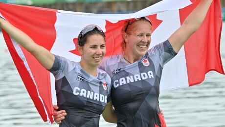 Canada's Laurence Vincent-Lapointe, right, and Katie Vincent, left, celebrate after winning the bronze medal in the women's canoe double 500-metre final at the Tokyo Olympics on Saturday in Japan. vincent-lapointe-vincent-080621
