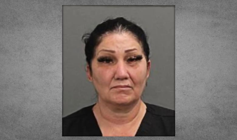 Brigitte Cleroux looks neutral in a mugshot. She is an Indigenous woman wearing black.