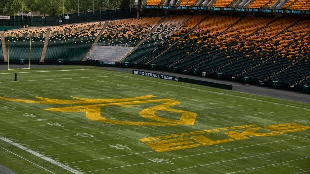 Due to the realignment of scheduling, the Elks will play three games over a seven day period later in the season. A yellow logo of an elk is painted on a green football field. The stands surrounding the turf are empty.