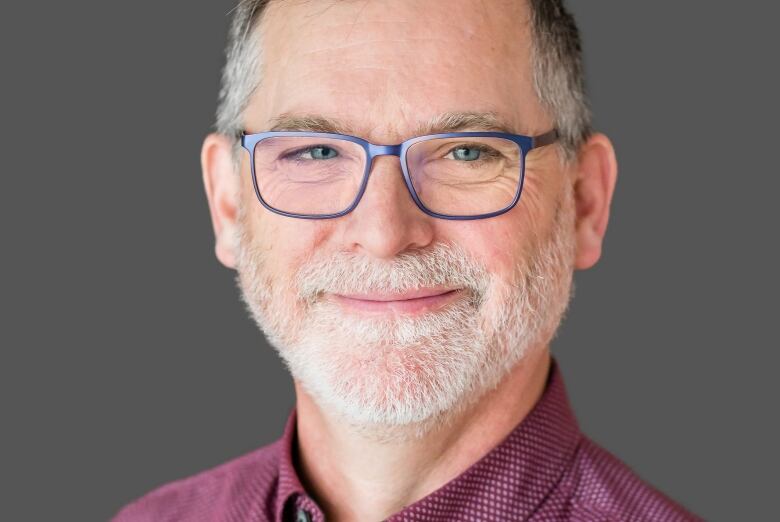 Athabasca University labour relations Prof. Jason Foster is pictured in a headshot.