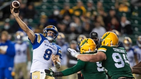 Blue Bombers quarterback Zach Collaros, left, went 19 of 24 passing for 252 yards, a TD and an interception during his team's win over the Elks at Commonwealth Stadium in Edmonton on Saturday. Winnipeg-Blue-Bombers-Edmonton-Elks-18092021