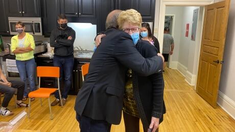 Liberal candidate Robert Morrissey receives a congratulatory hug from a supporter Monday night. Robert Morrissey