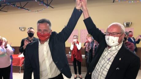 Heath MacDonald, left, celebrates with Wayne Easter, the Liberal MP who had represented Malpeque since 1993. Heath MacDonald
