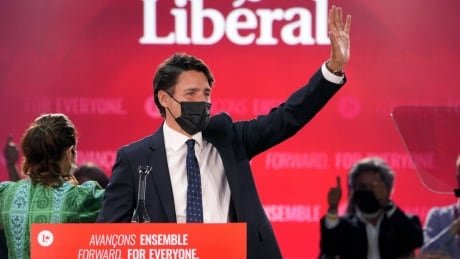 Prime Minister Justin Trudeau greets supporters prior to his victory speech at Party campaign headquarters in Montreal, early Tuesday, Sept. 21, 2021. THE CANADIAN PRESS/Paul Chiasson Justin Trudeau federal election Canada