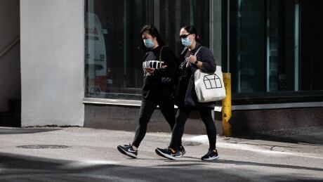 People wear facemasks to prevent the spread of COVID-19 while out on Robson Street in downtown Vancouver on Sept. 15, 2021. COVID DAILY LIFE