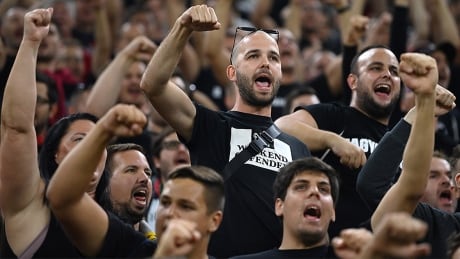 While many of Hungary's soccer fans showed support for their team during a Sept. 2 World Cup qualifying match, pictured, there were incidents of racial abuse toward players from England. As a result, the Hungarian team will host Albania on Oct. 9 in an empty stadium. hungary-soccer-fans-210902-1180