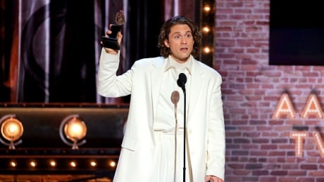 Aaron Tveit accepts the award for Best Performance by an Actor in a Leading Role in a Musical for "Moulin Rouge! The Musical" onstage during the 74th Annual Tony Awards at Winter Garden Theatre on September 26, 2021 in New York City. (Photo by Theo Wargo/Getty Images for Tony Awards Productions) Aaron Tveit